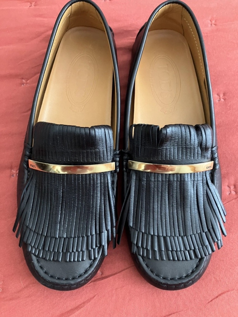 Tod's Black Leather Fringe Kilti Loafers with Gold Accent and Dust Bag.